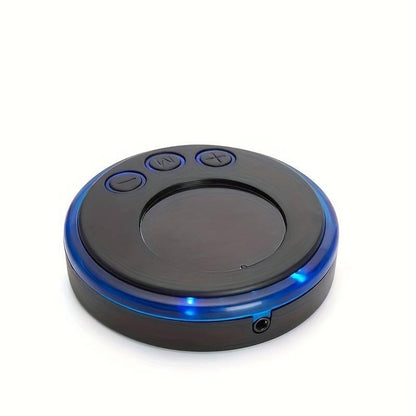 Appareil de massage facial anti-déformable avec design rond et touches de contrôle, couleur noire avec éclairage bleu.