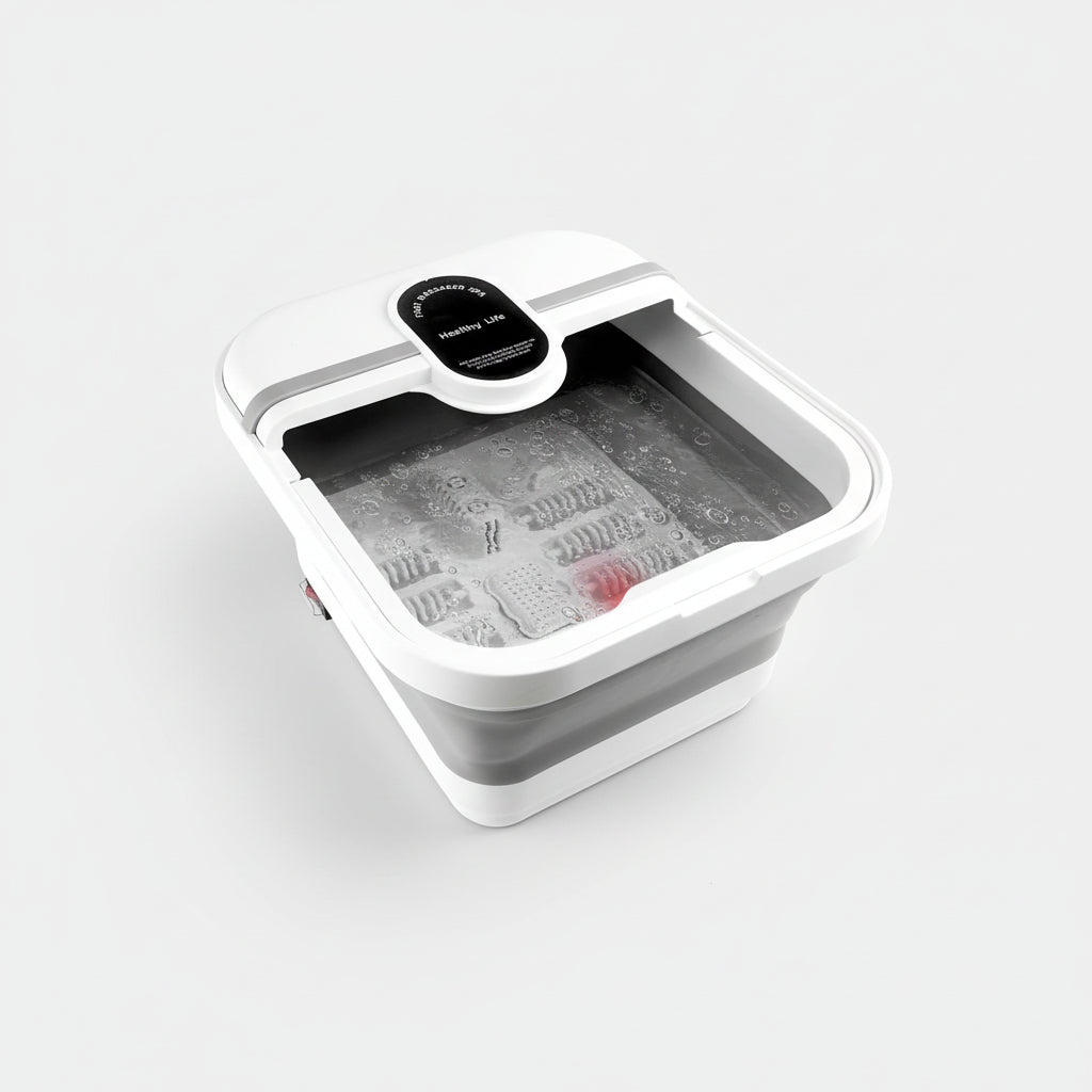 Bain de pied - Bassin pliable électrique avec massage et chauffage – vue en plongée d'un bassin blanc avec eau et bulles, boutons de contrôle visibles