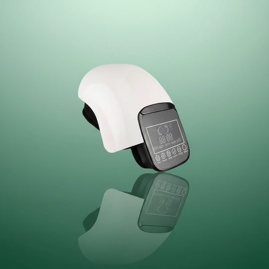 Appareil de physiothérapie | Massage du genou, pression d'air et Vibration – Vue latérale sur fond vert, couleur blanche avec écran tactile noir.