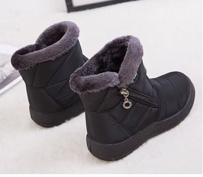 Boots Imperméable Femme noires avec col en fourrure grise, vue arrière, fermeture éclair sur le côté et semelle épaisse.