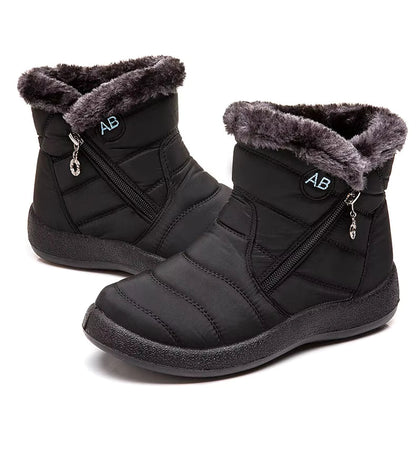 Boots Imperméable Femme noires avec doublure en fourrure grise, vue générale mettant en avant la texture du matériau et la fermeture éclair.