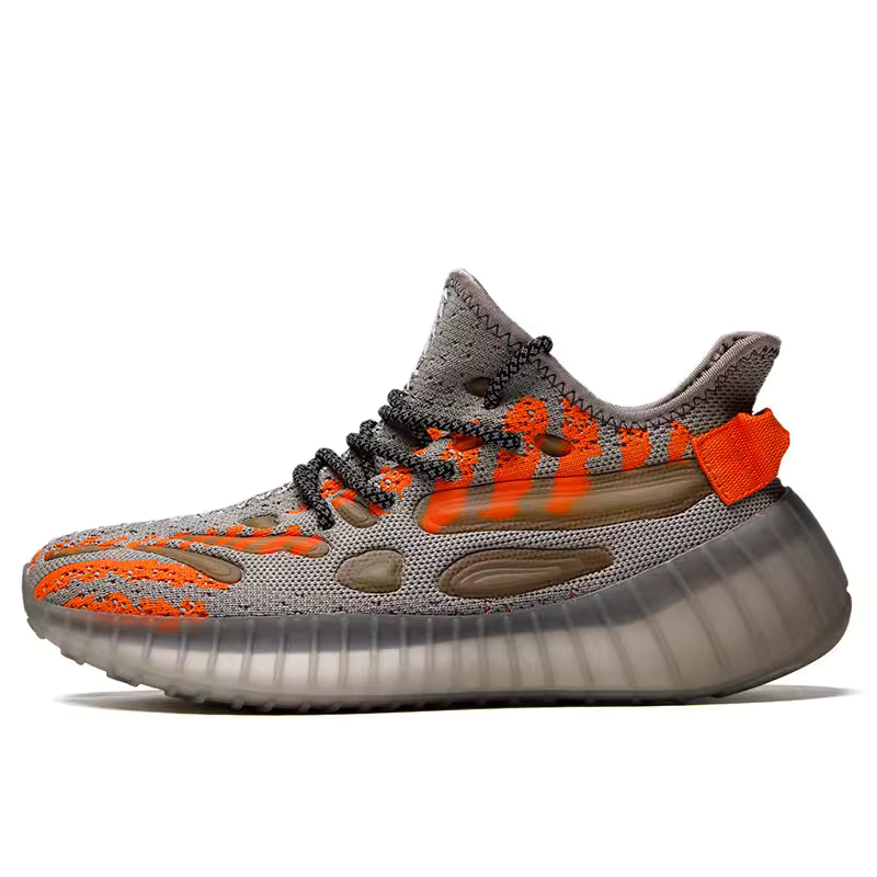 Baskets légères pour diabétiques – vue latérale sur des chaussures en mesh gris avec des accents orange et semelle transparente.