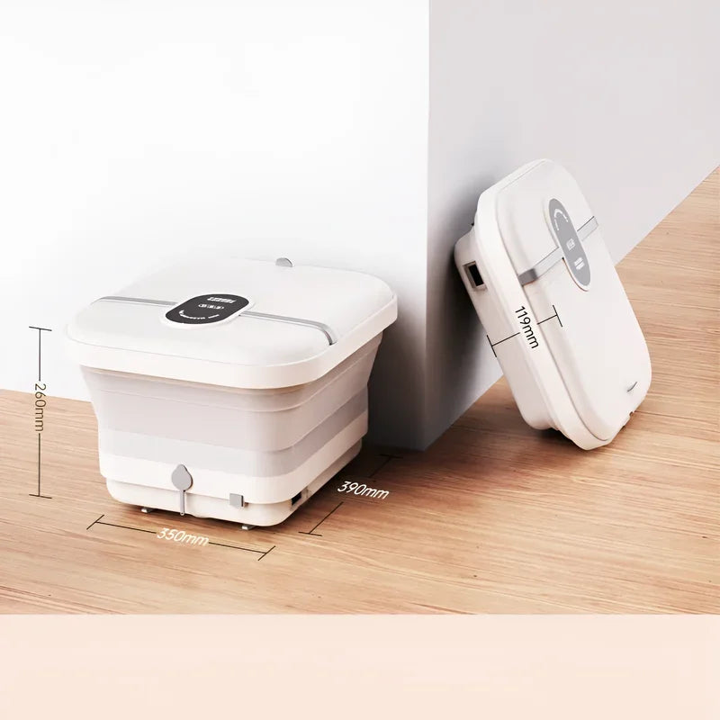 Bain de pied - Bassin pliable électrique avec massage et chauffage – vue générale du produit plié, couleur blanche sur un sol en bois