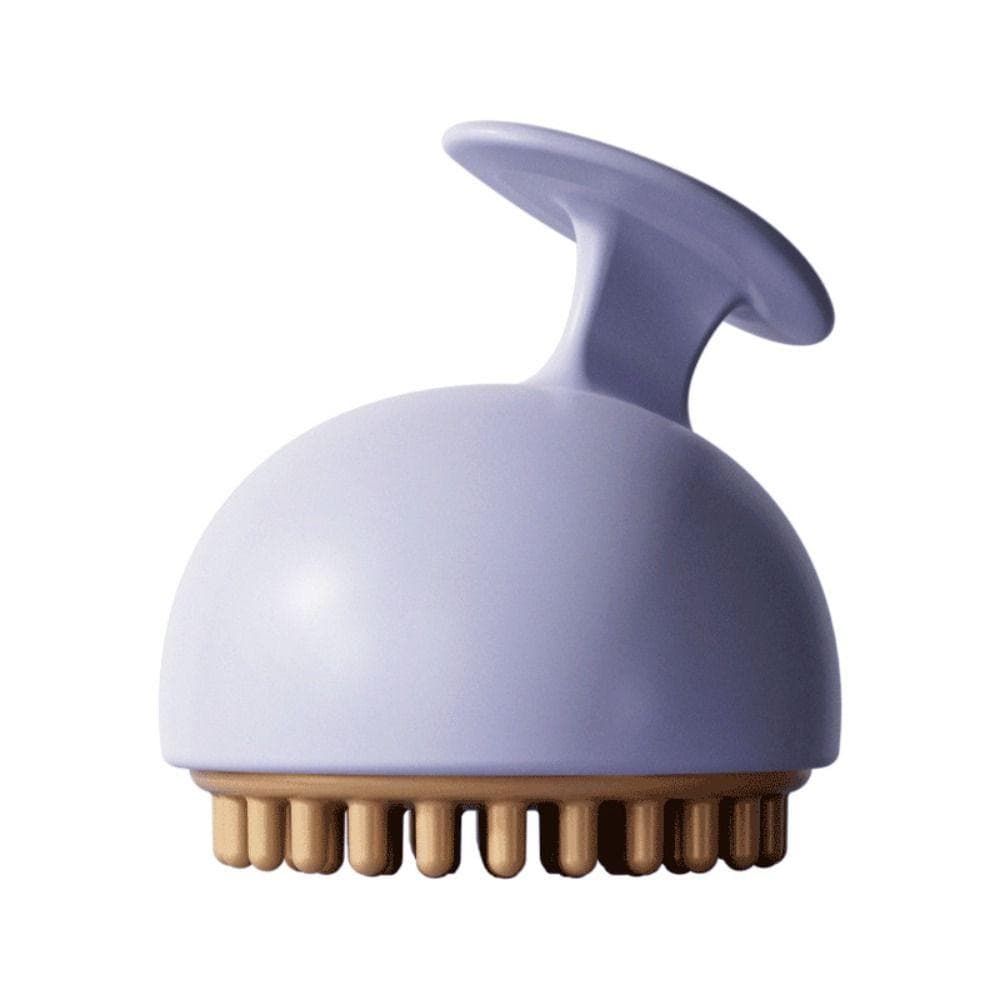 Brosse de massage anti-cellulite manuelle en silicone, couleur lavande avec picots dorés, vue de dessus sur fond blanc.