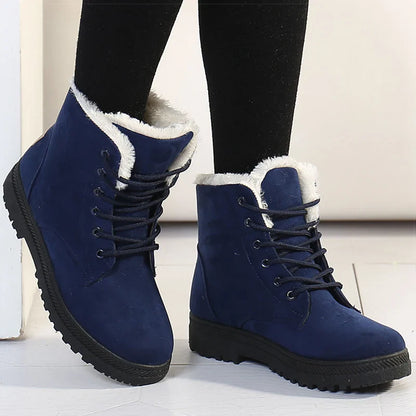 Bottines à Lacets Femme en velours bleu marine avec doublure en fausse fourrure, portées avec des collants noirs.