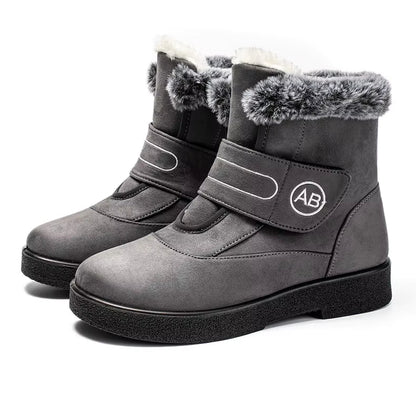 Bottines Femmes - Modèle AB en cuir gris avec doublure en fourrure, vue latérale, semelle antidérapante et fermeture velcro.