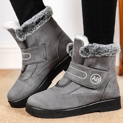Bottines Femmes - Modèle AB en cuir gris avec doublure en fourrure, vue de côté, semelle antidérapante visible.