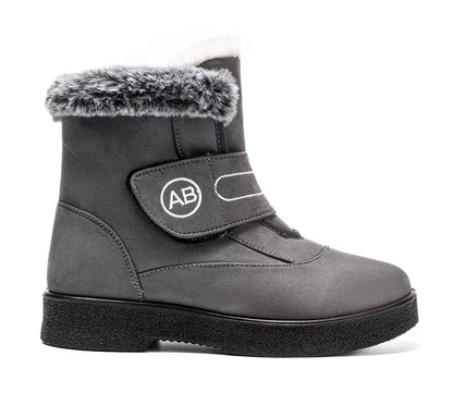Bottines Femmes - Modèle AB en cuir gris avec fourrure synthétique, vue latérale, semelle épaisse et antidérapante.