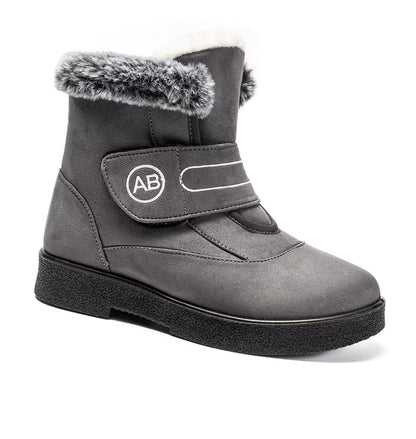 Bottines Femmes - Modèle AB en cuir gris avec fourrure synthétique, vue de face, semelle antidérapante et fermeture velcro.