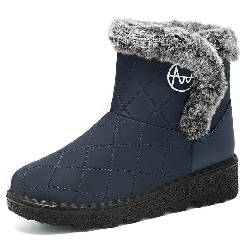Bottines d'Hiver Femme couleur bleu marine avec fourrure grise, vue de côté, design matelassé et semelle épaisse.