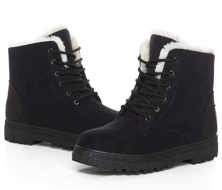Bottines à Lacets Femme en cuir noir avec doublure en fausse fourrure, vue latérale montrant les lacets et la semelle antidérapante.