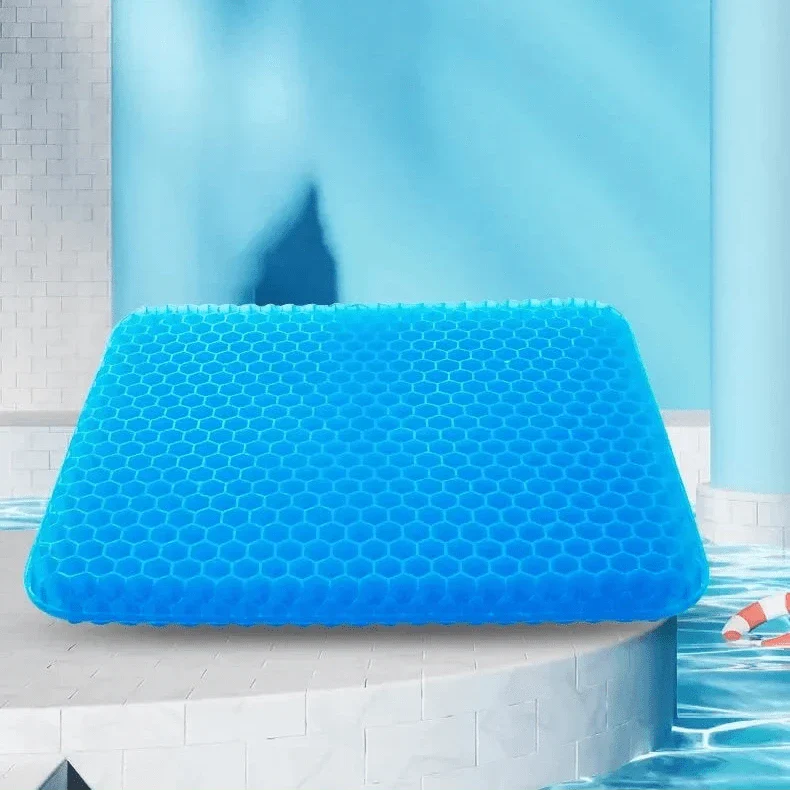 Coussin Orthopédique en Nid d’Abeille – vue de face avec texture alvéolée en bleu, posé sur une surface claire